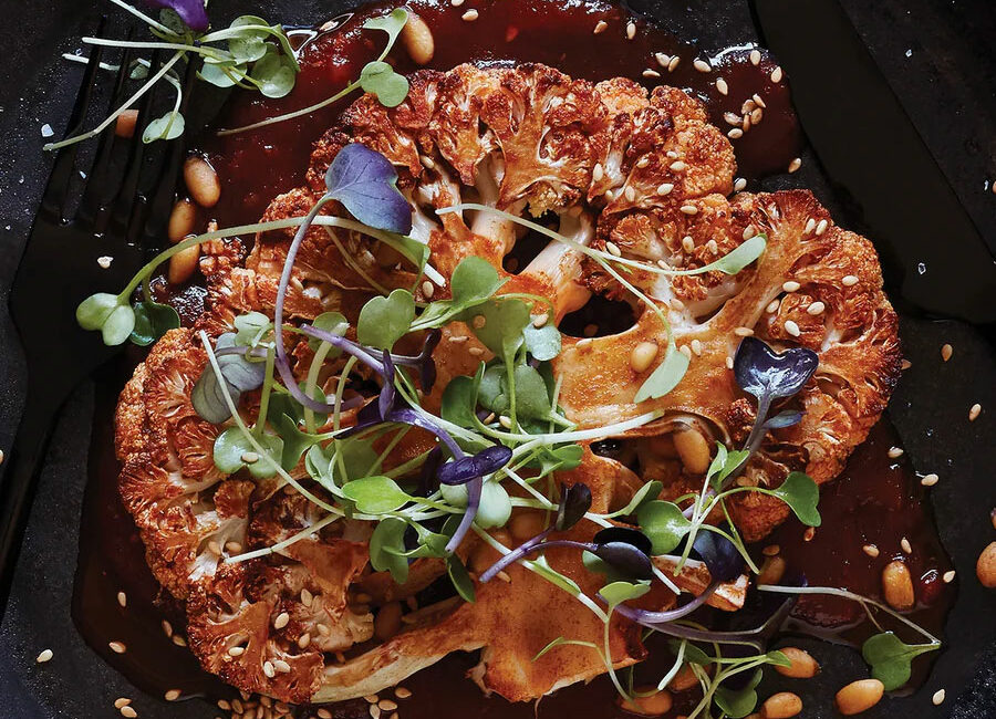 smoky-cauliflower-steaks-with-tomato-sauce-and-microgreens-recipe-urban-900x650